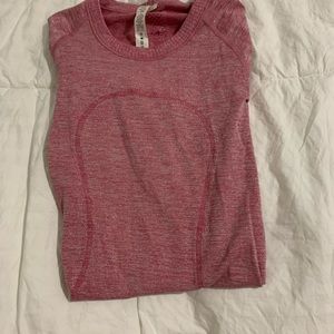 Lululemon pink shimmery long-sleeve top.